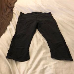 black Lululemon pants with mesh detail